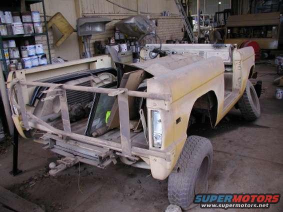 Body of a 1978 Ford Bronco, missing its top and doors, in a workshop