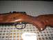 1991 Ford Bronco - CZ Model 550 Magnum rifle with a wooden stock and checkered grip is shown.
