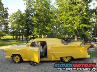 Yellow 1953 Ford Mainline sedan delivery with fins and custom roofline