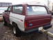1979 Ford Bronco - This Ford Bronco has a two-tone paint job with one side in primer, showing some rust.