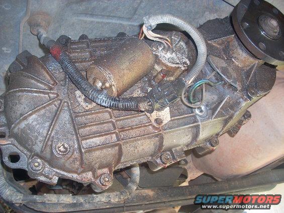 Transfer case with electrical connector and drive shaft flange