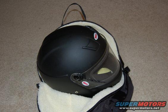 Black Bell helmet with clear visor inside a padded bag