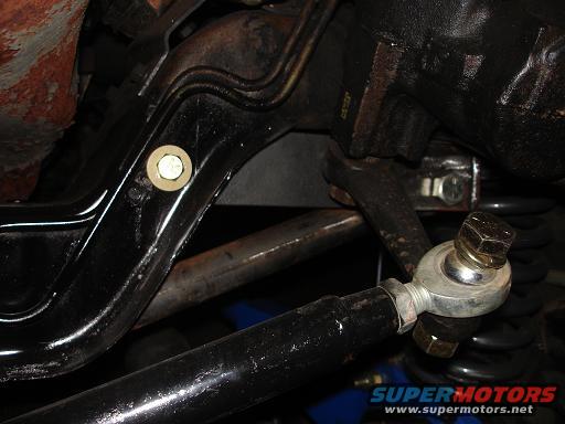 Close-up of a suspension tie rod end with a bolt and washer