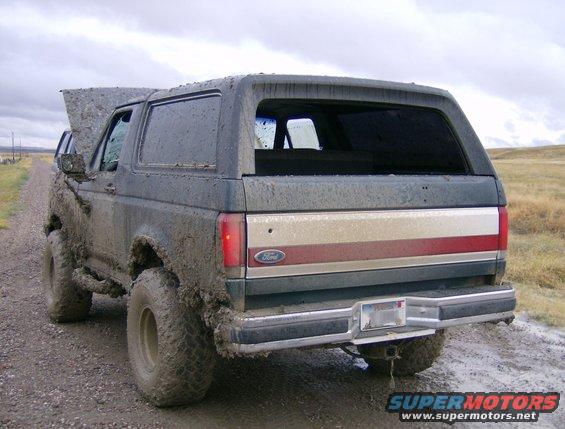 Mud-covered 1990 Ford Bronco rear view