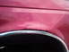 1994 Ford Bronco - Rust is visible around the wheel well of this pink 1994 Ford Bronco.