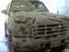 1996 Ford Bronco - Front view of a 1996 Ford Bronco being washed, suds covering the grille and hood.