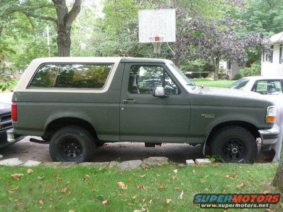 1992 Ford Bronco parked on grass, side view