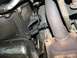 1985 Ford Crown Victoria LTD - Close-up view of a vehicle's undercarriage, focusing on the transmission and exhaust components.