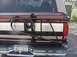 1996 Ford Bronco - The rear of a maroon and white Ford Bronco is visible, equipped with a spare tire carrier and a New York license plate.