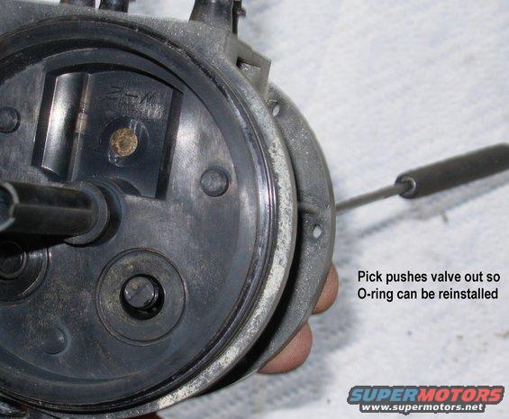 d12check.jpg Dual Function Reservoir Check Valve 

WIth the supply switching valve removed, a bent probe can be used to push the check valve out far enough to reinstall the O-ring.

If the return check valve falls or leaks, it cannot be accessed.

To permanently eliminate the reservoir, use [url=https://www.amazon.com/dp/B0033YHPHG]these Dorman fuel tubes[/url].