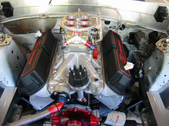 Engine bay with Ford Racing valve covers and a Holley carburetor