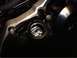 1999 Kawasaki H2C - Close-up view of a motorcycle engine's oil sight glass and surrounding casing.