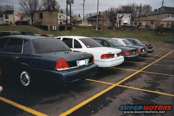 Rear view of a 1998 Ford Crown Victoria in a parking lot