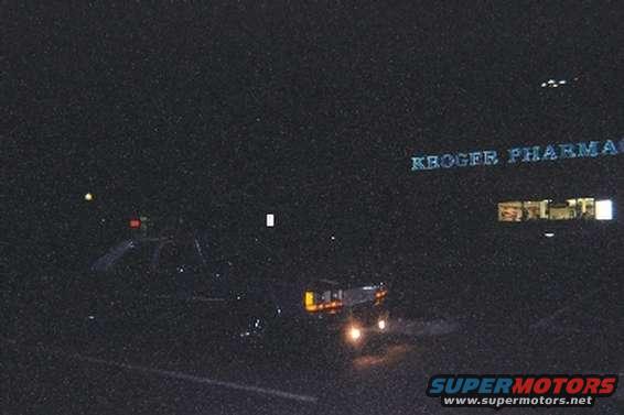 A nice picture at night with the fogs and parking lights on
