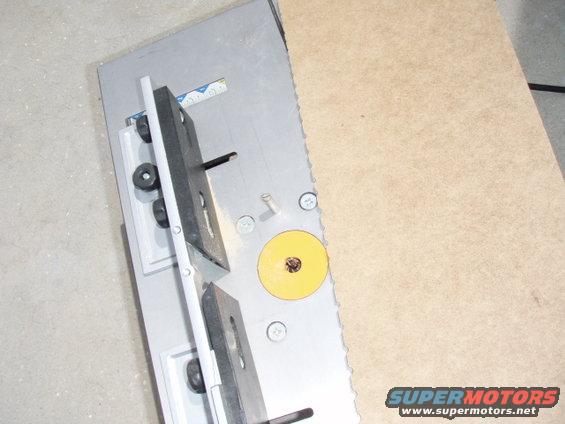 p9090001.jpg Directions called to brush, roll, or trowl(sp?) it on.  I didn't have a brush to waste, or a roller for that matter.  So I took scrape from the drawer bottom and cut notches to make a trowl.  It was wide too, which made for short work.