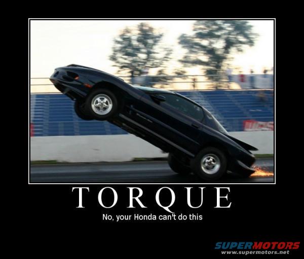 Black car doing a wheelie on a drag strip, with sparks flying from the rear