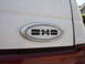 1990 Ford Taurus - Close-up of the SHO badge on the rear of a white vehicle.