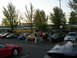 2007 Mazda 3 - Car enthusiasts meet up in a parking lot with several vehicles on display.