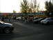 2007 Mazda 3 - A group of people gather around cars parked in a lot during a meet-up.