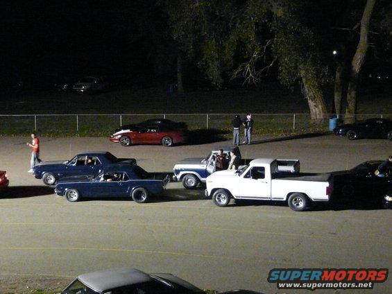 Neat picture or my cousins 79 F150, my 82 F100 and some older Mustangs in front of us, waiting in staging.