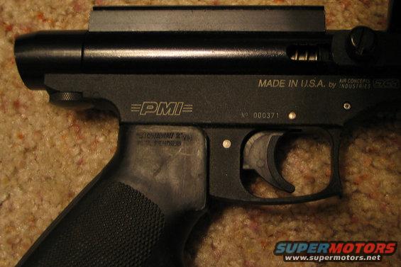 Close-up of black air gun receiver with PMI logo and Made in USA text