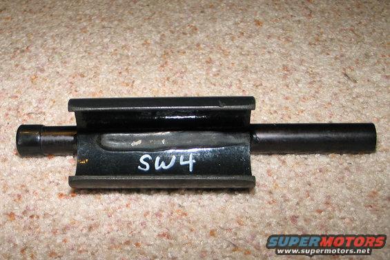 Metal part with SW4 written on it