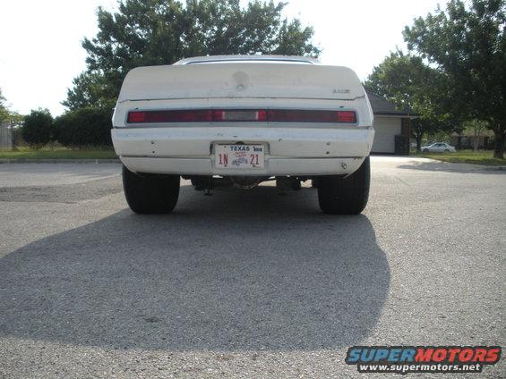 Rear view of a white 1972 Dodge Avenger with wide tires and a Texas license plate