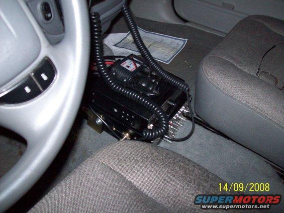 CB radio mounted between car seats, 2008 date stamp