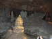 2006 Ford E350 - A view inside a cave, various natural rock formations like stalagmites and stalactites.