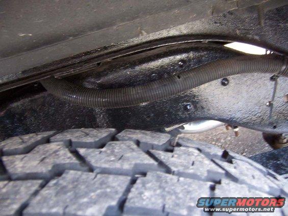 batt-reloc-4.jpg Keeping it up tight to top of frame in back wheel well