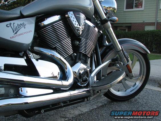 Silver Victory motorcycle engine and front wheel with chrome exhaust