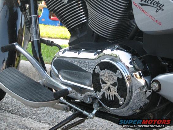 Motorcycle engine with chrome skull and crossbones cover and Victory Motorcycles text