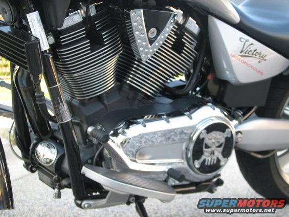 Victory motorcycle engine with chrome skull cover and 'Victory MOTORCYCLES' text on side panel