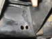 1991 Ford Bronco - Close-up view of a vehicle's frame, showing two circular holes.