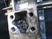 1987 Suzuki Samurai - Damaged transfer case housing shows internal wear and debris.