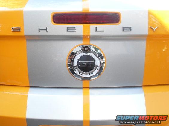 Rear of a car with Shelby GT Ford badging and orange and silver racing stripes
