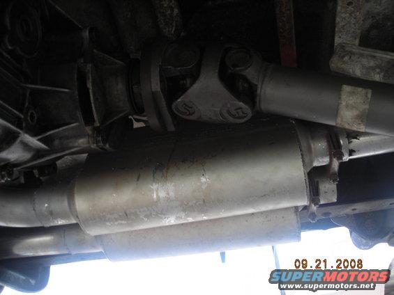 Underside view of a vehicle's exhaust system with dual mufflers and a driveshaft. Date stamp reads 09.21.2008