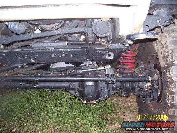 1978 Ford Bronco undercarriage with red coil springs and black suspension components