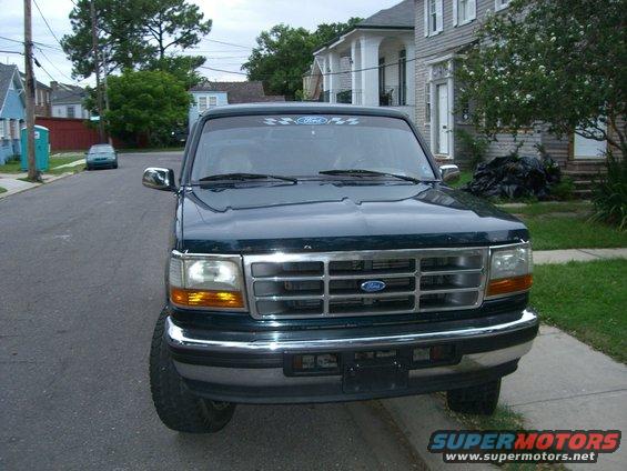 Front view of a 1995 Ford Bronco parked curbside on a street