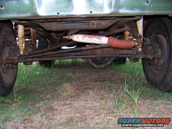 1979 Ford Bronco front undercarriage with steering linkage and shock absorber