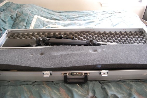 Rifle in a silver case with foam padding