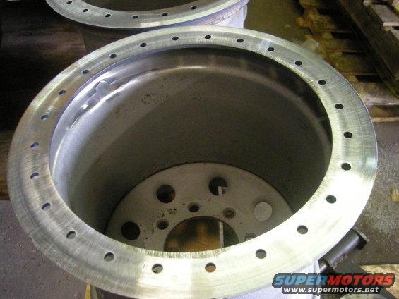 close-up of a large metal wheel rim with many bolt holes