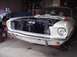 1967 Ford Mustang - Front view of a white 1967 Ford Mustang with its hood open, revealing the engine compartment.