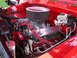 1979 Ford F-250 - The engine bay features a polished Ford Motorsports V8 engine with bright red accents and wiring.