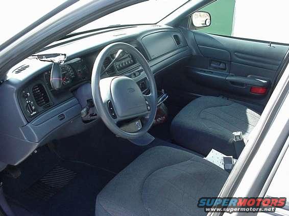 Interior view of a 2000 Ford Crown Victoria, showing dashboard and seats