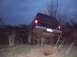 1984 Ford Bronco II - A black 1984 Ford Bronco II navigates rough terrain in the twilight.