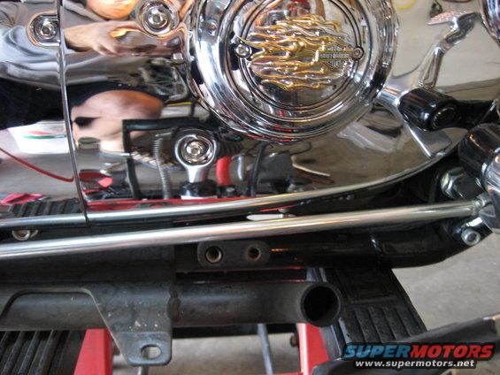 Chrome engine cover with flame detail on a 2004 Harley-Davidson Sportster Custom