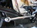 2004 Harley-Davidson Sportster Custom - Close-up view of a motorcycle's drive belt and linkage system.