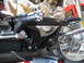 2004 Harley-Davidson Sportster Custom - Detail shot of a motorcycle's engine and rider controls, focusing on chrome and black components.