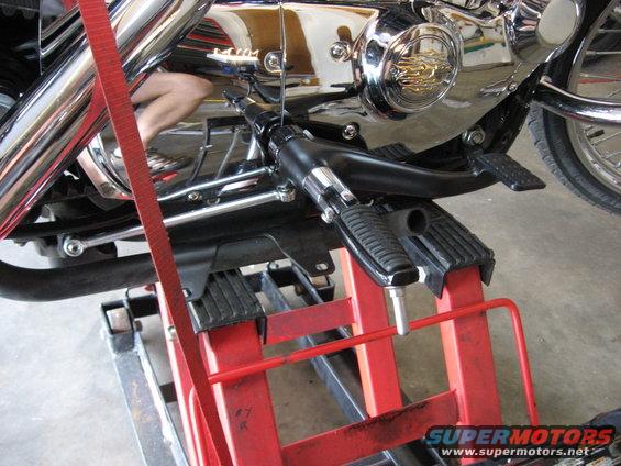 2004 Harley-Davidson Sportster Custom engine and foot controls on a red lift